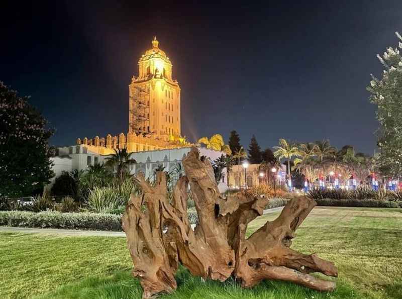 a large tree stump in front of a building