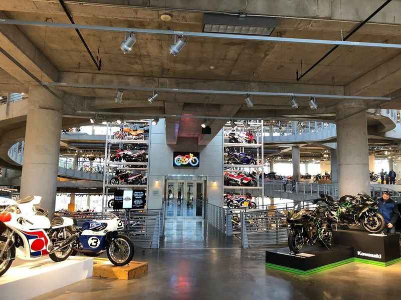 a motorcycle show room with motorcycles on display