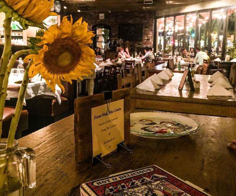 a sunflower in a vase on a table