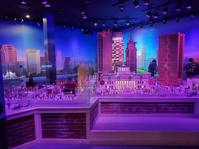 a model of a city with buildings and people