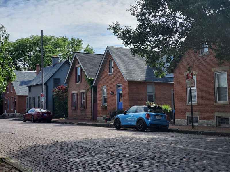 a blue car parked on a the street