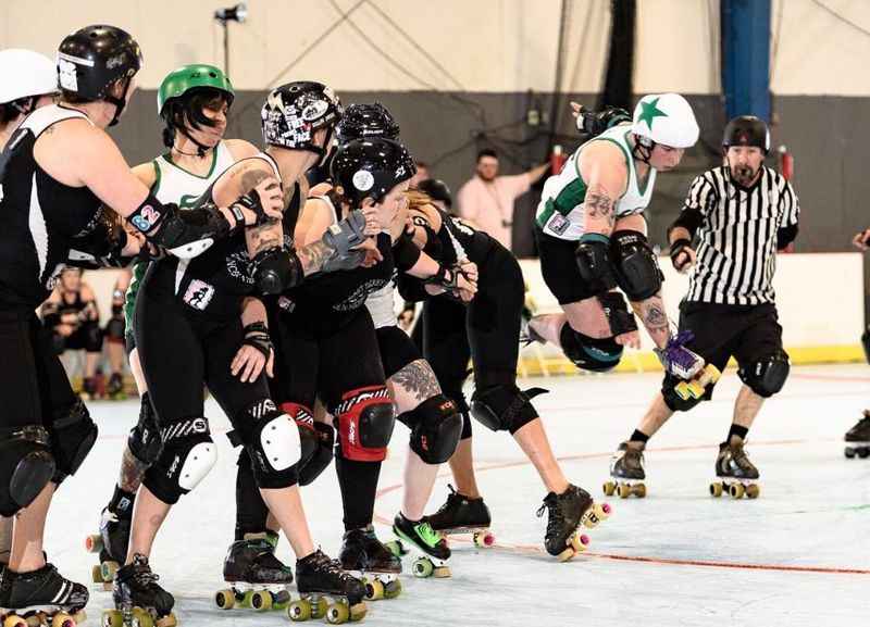 a group of people playing a game of roller skate