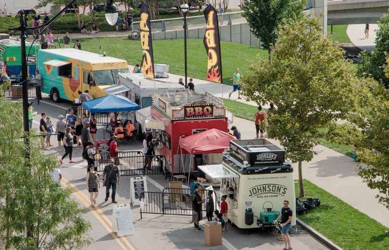 a food truck parked on the side of a road