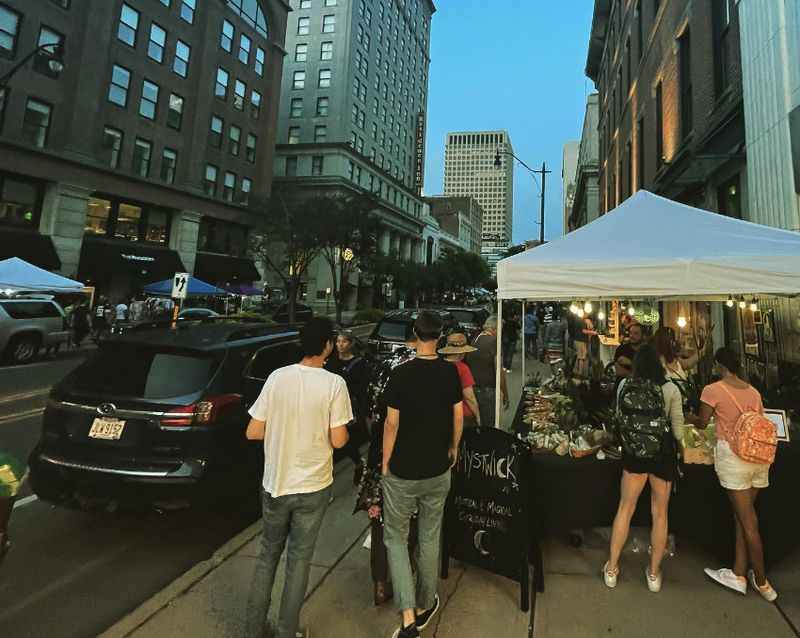 a group of people standing around a table