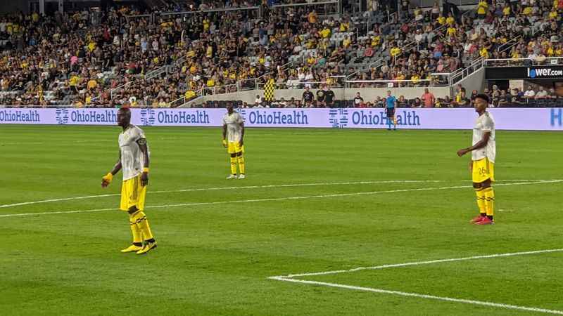 a soccer game with players on the field