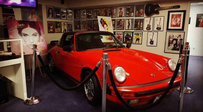 a red car parked in a room