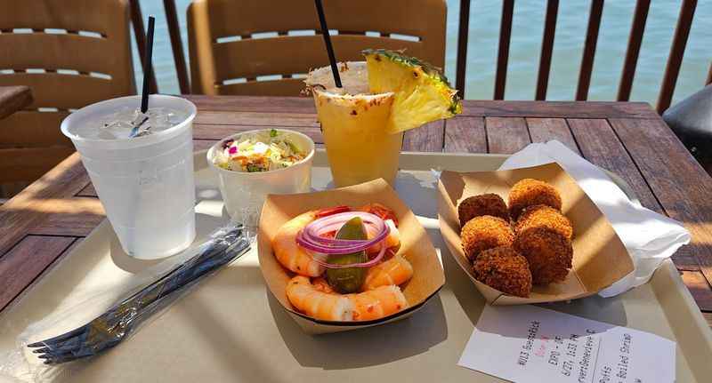 a table with a plate of food and drinks