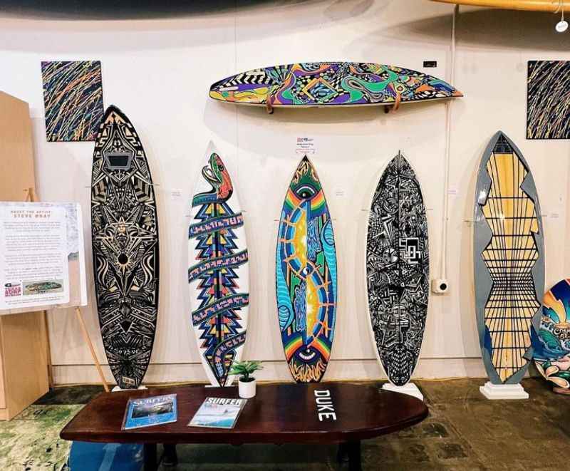 different design of surfboards displayed in a room