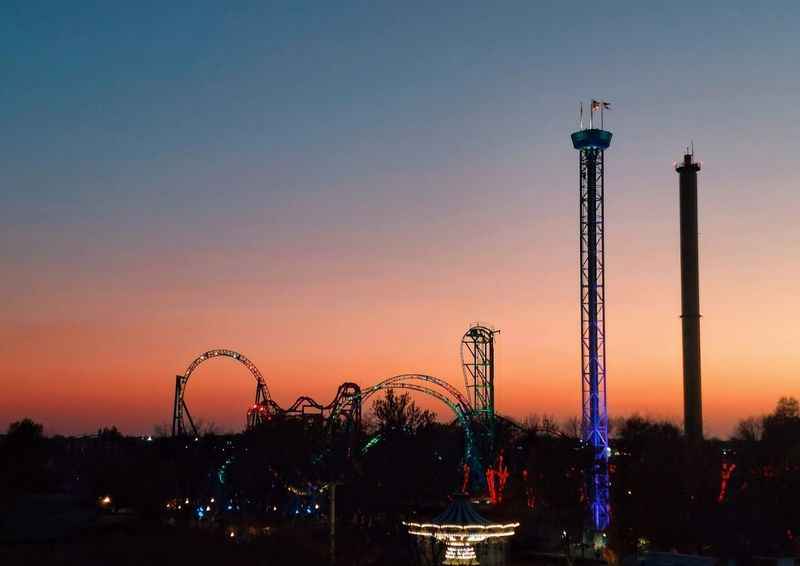 a roller coaster at sunset