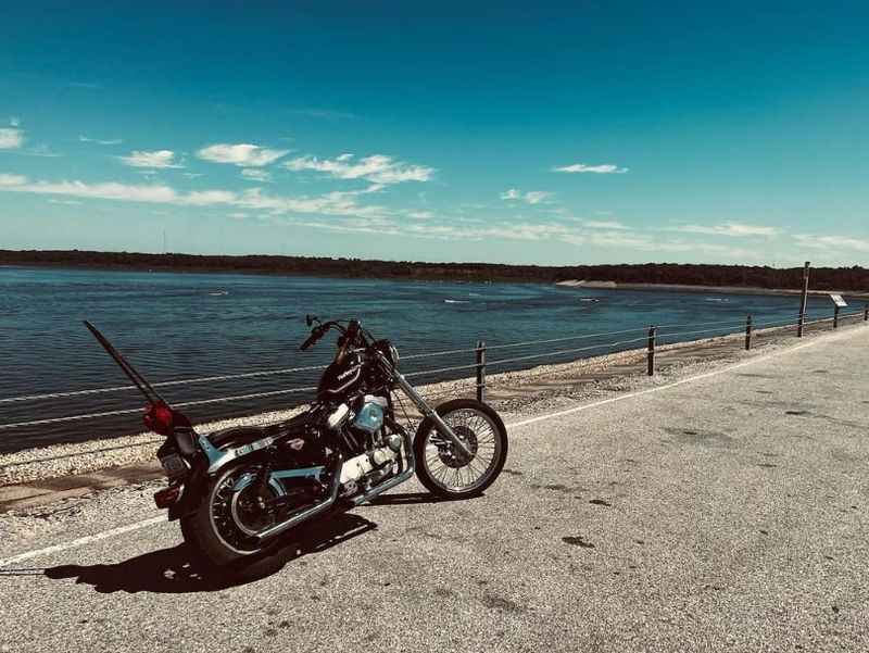 a motorcycle parked on the side of a road