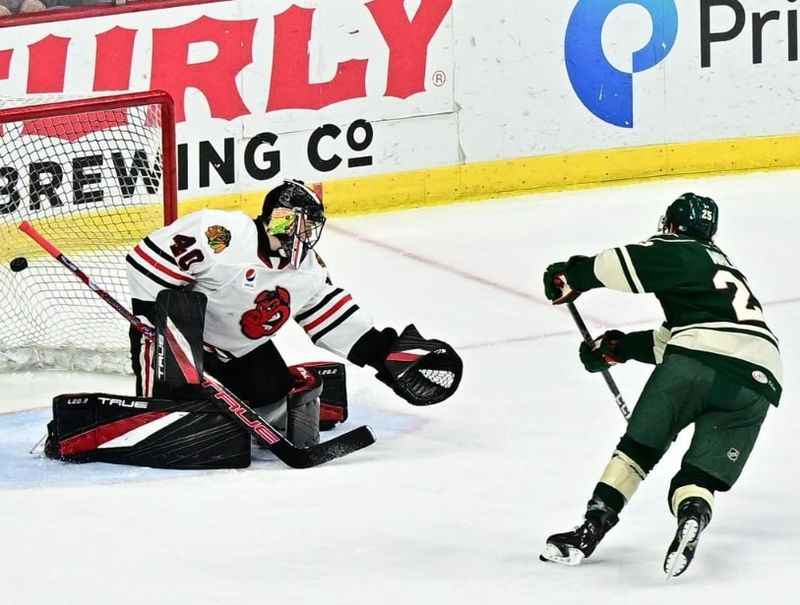 a hockey player is making a save on the ice