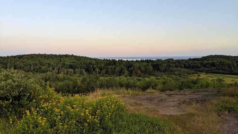 a view of the ocean from a hill