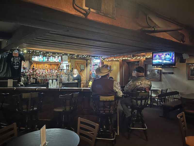 the bar with two men seated