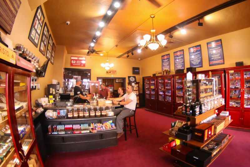 a store with a counter and a woman in the front