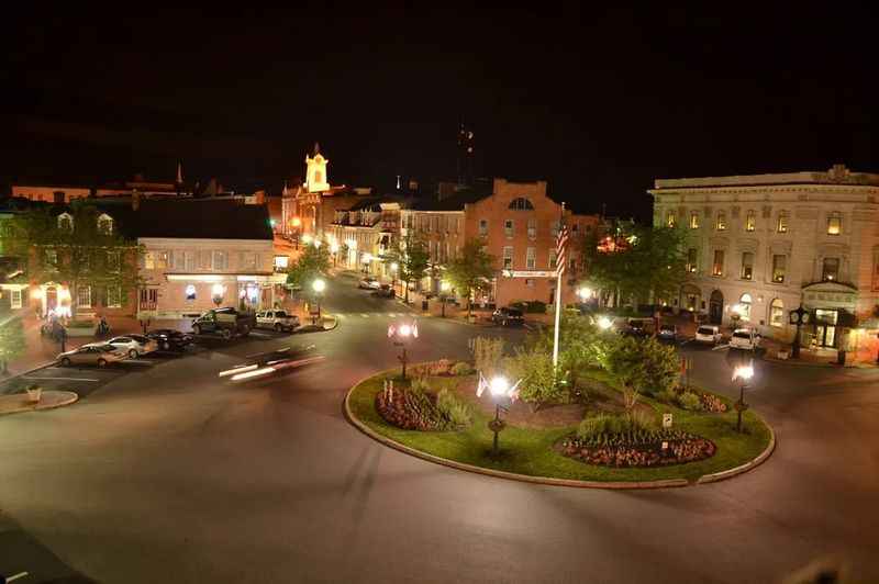 a view of a city at night without people around