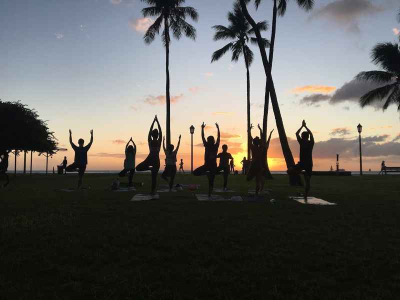 yoga in hawaii at sunset