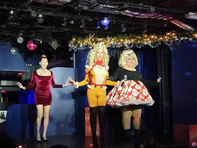 a group of dressed women performing on the stage