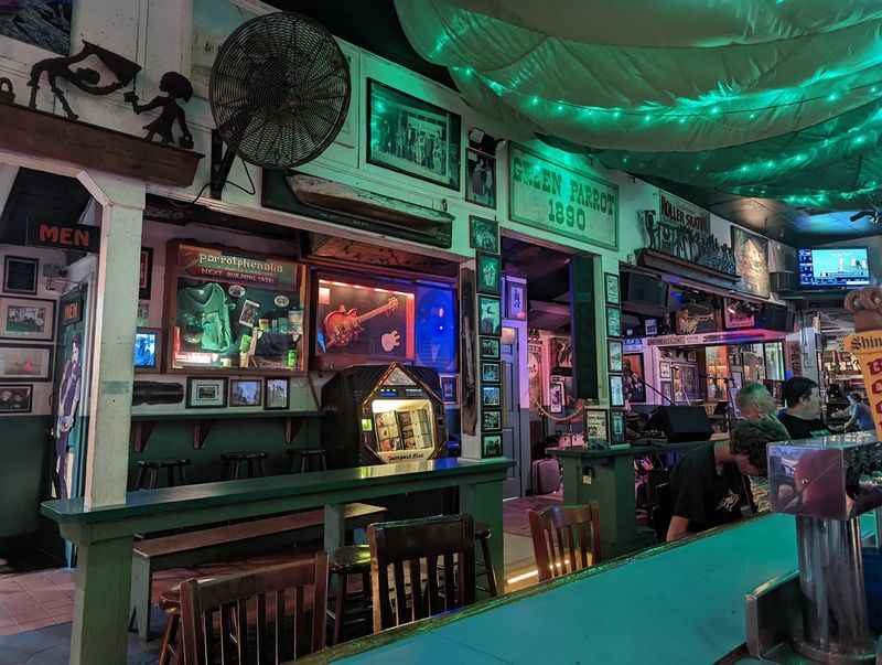 a bar with a green ceiling and a green ceiling
