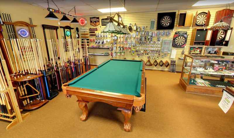 a pool table in a room with a pool and billiard