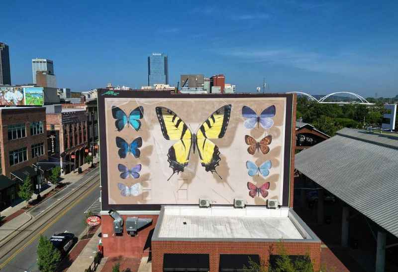 a large billboard with a large butterfly on it