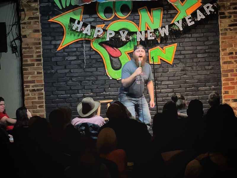 a man standing on a stage with a microphone