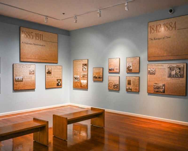 a room with several framed photographs on the wall