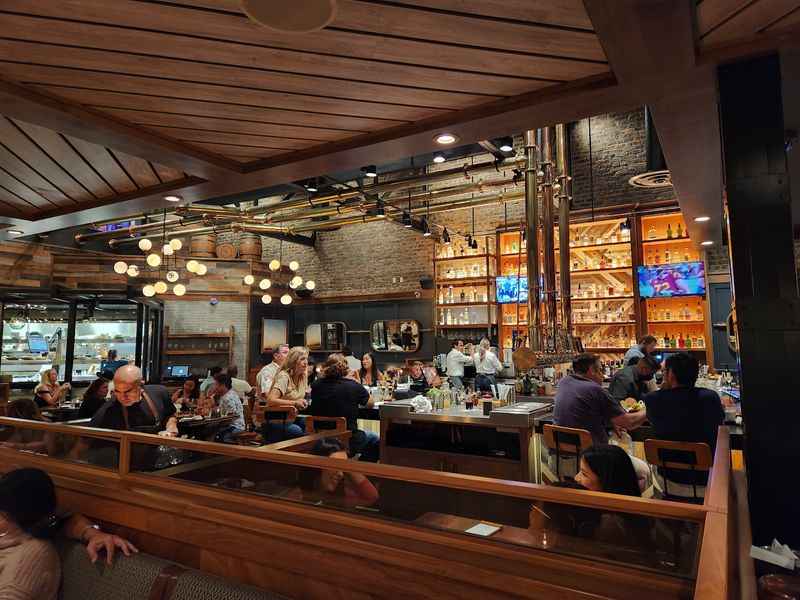 a restaurant with people sitting at tables and eating