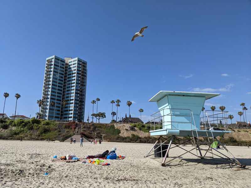 a beach chair and a beach chair on the sand