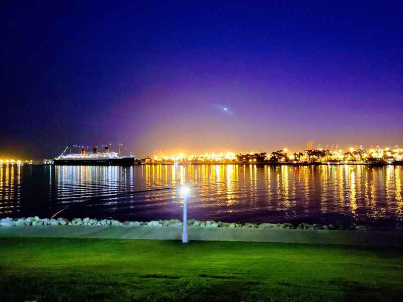 a body of water with a city skyline view