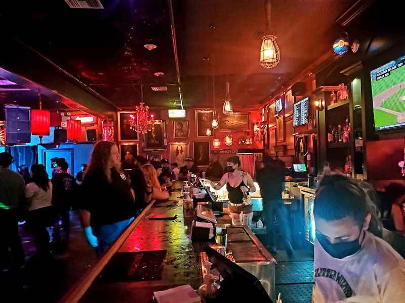 a group of people sitting at a bar