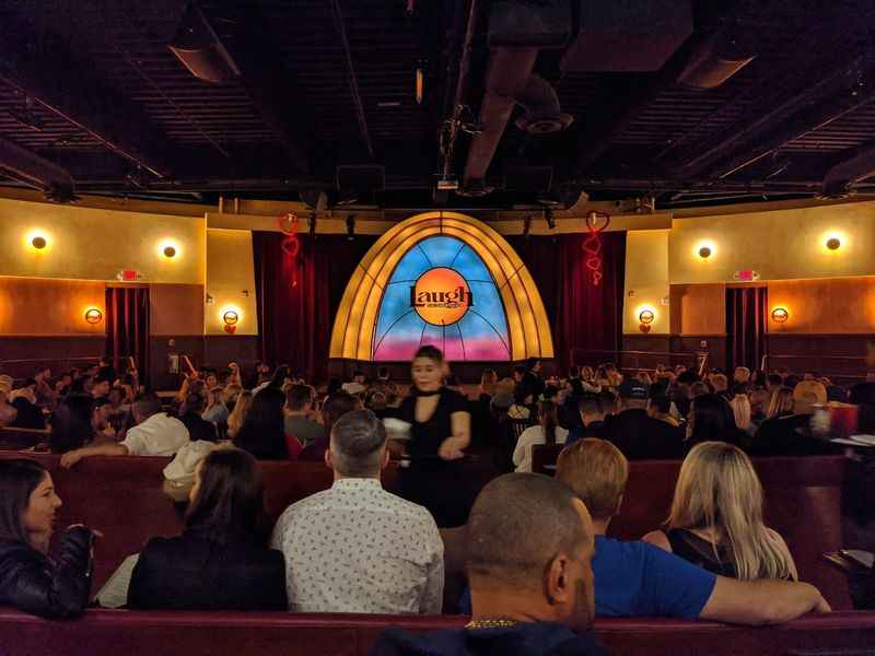 a large crowd of people sitting in the club