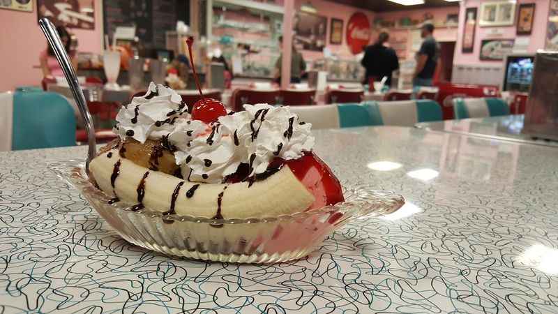 banana split desert with cherry on top