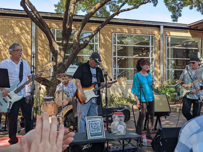 a group of people playing music outside