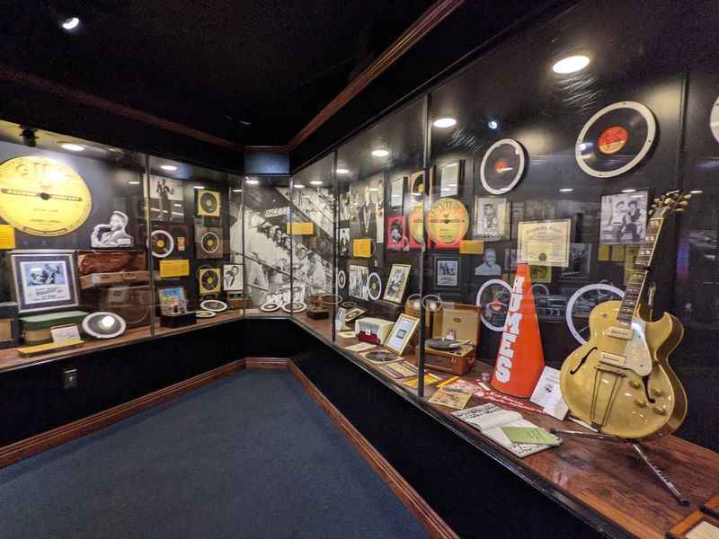 a room with guitars and other instruments