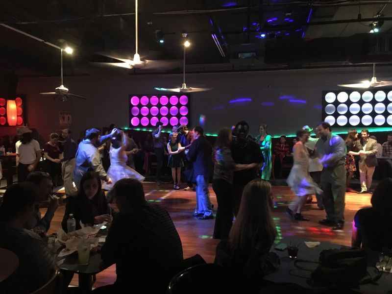 a group of people dancing in a room