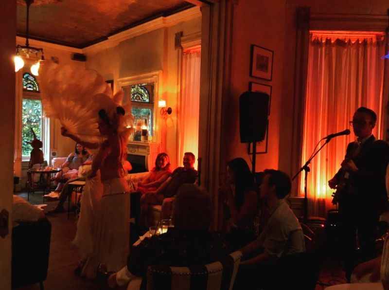 a woman in a white dress is dancing