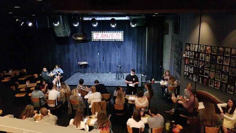 a group of people sitting at tables in a room