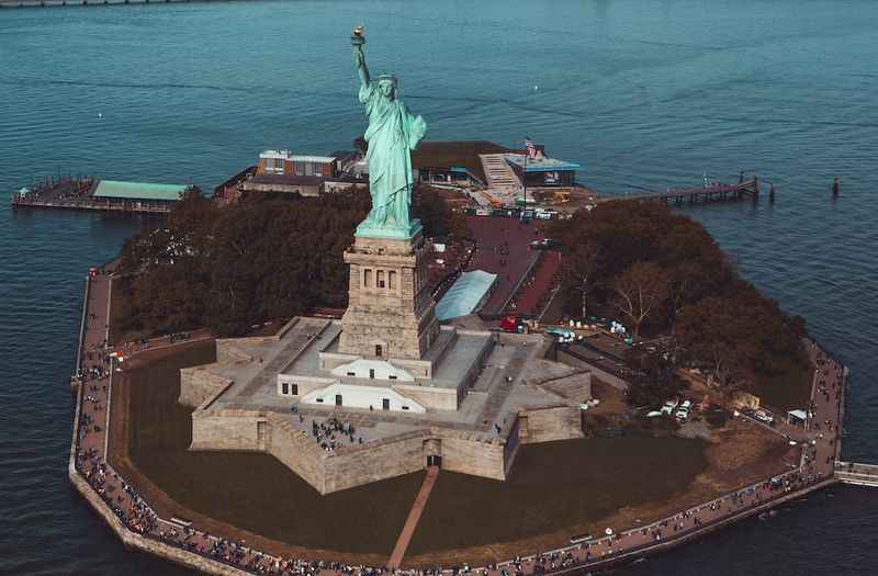 the statue of liberty in the middle of the island