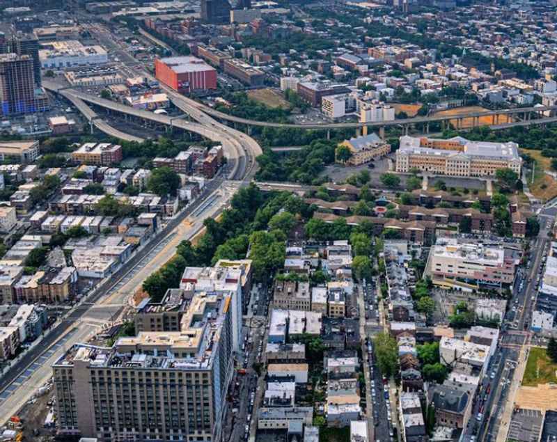 aerial view of city with buildings and trees