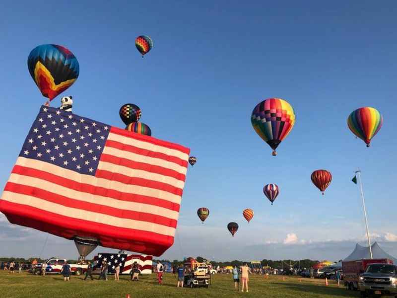 different hot air balloons, one with US Flag design 