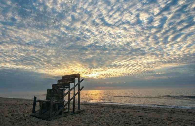 calm waves of the ocean at sunset