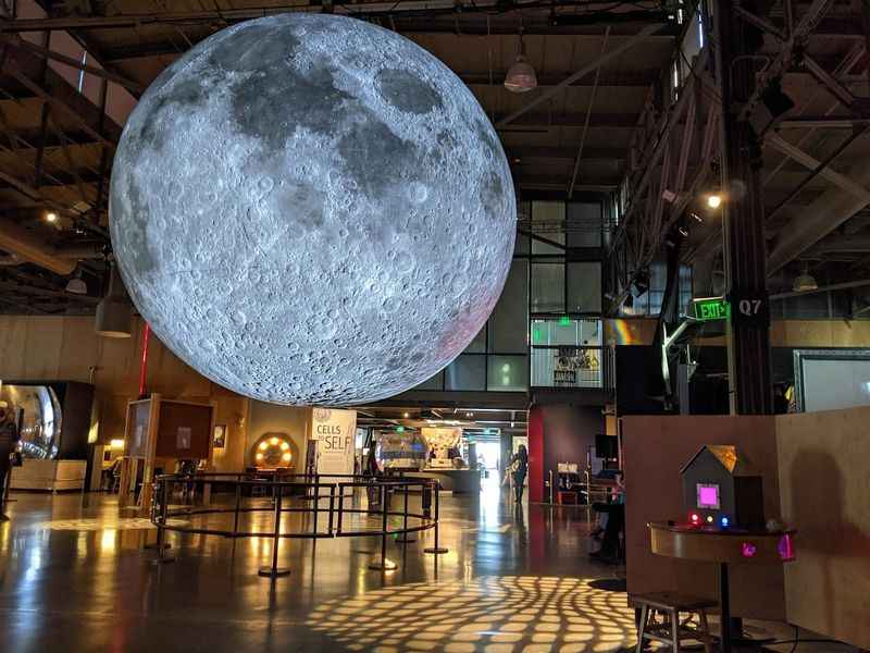 view of a large moon hanging from the ceiling