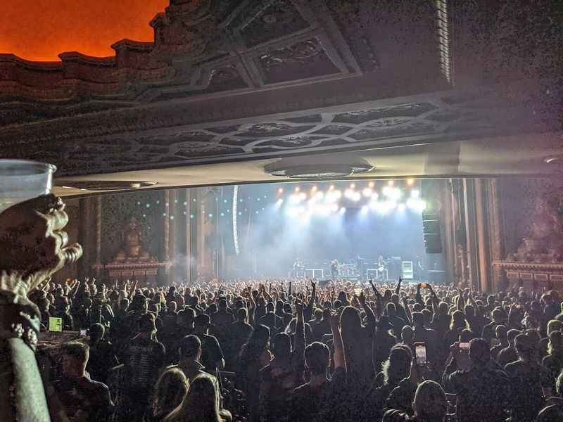 a crowd watching a band perform on stage