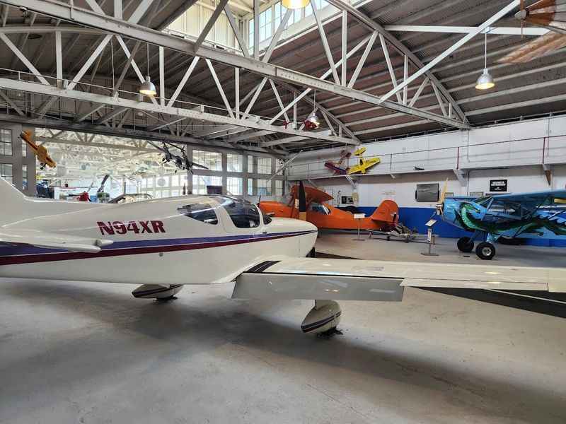 a small plane that is parked inside the museum