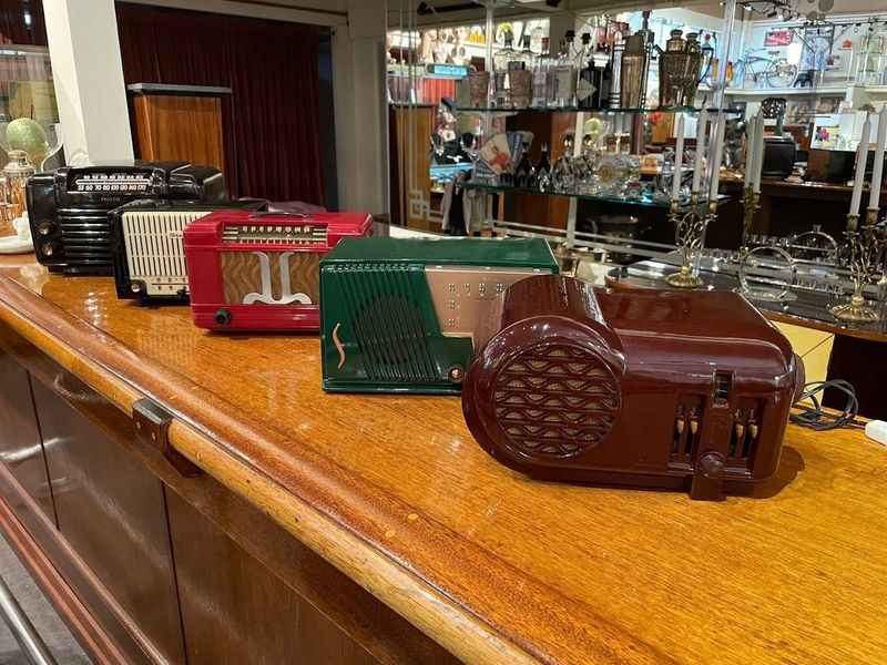 a different types of vintage radio on the table