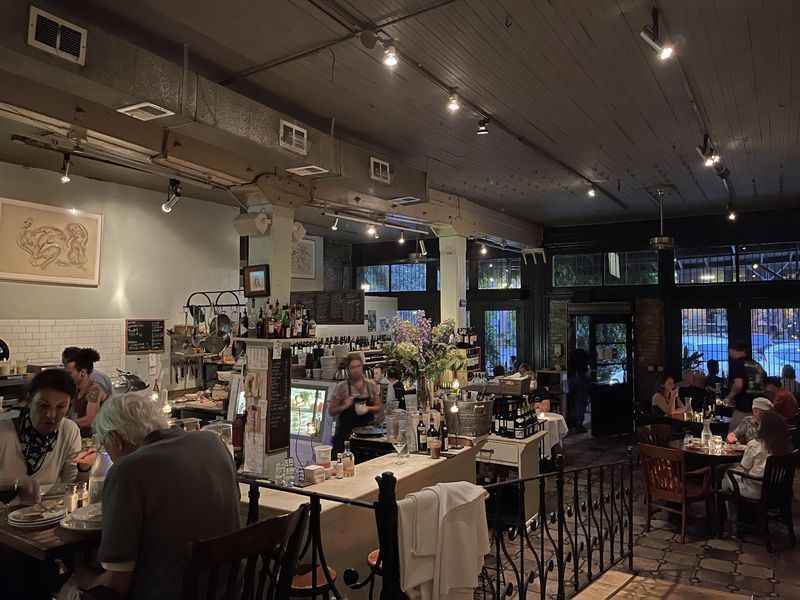 a restaurant with people sitting at tables and eating