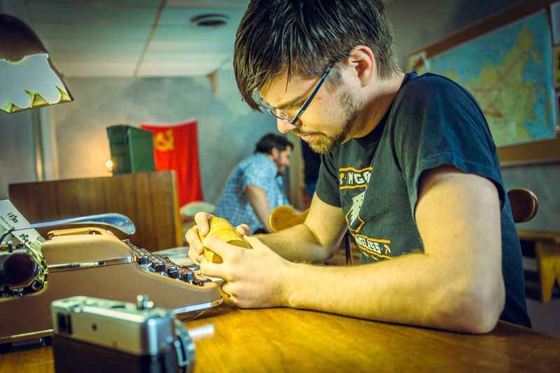 a man working on a table in a room