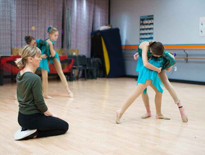 a group of young girls in a dance class