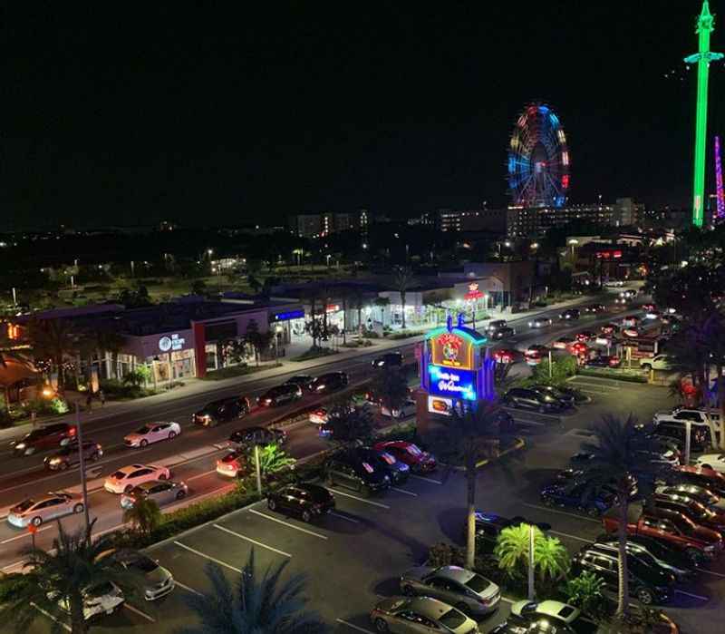 a view of the city from a balcony at night