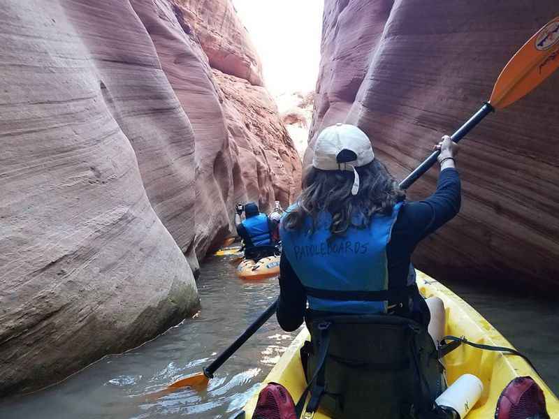 a woman in a kayak that rows on canyon lake